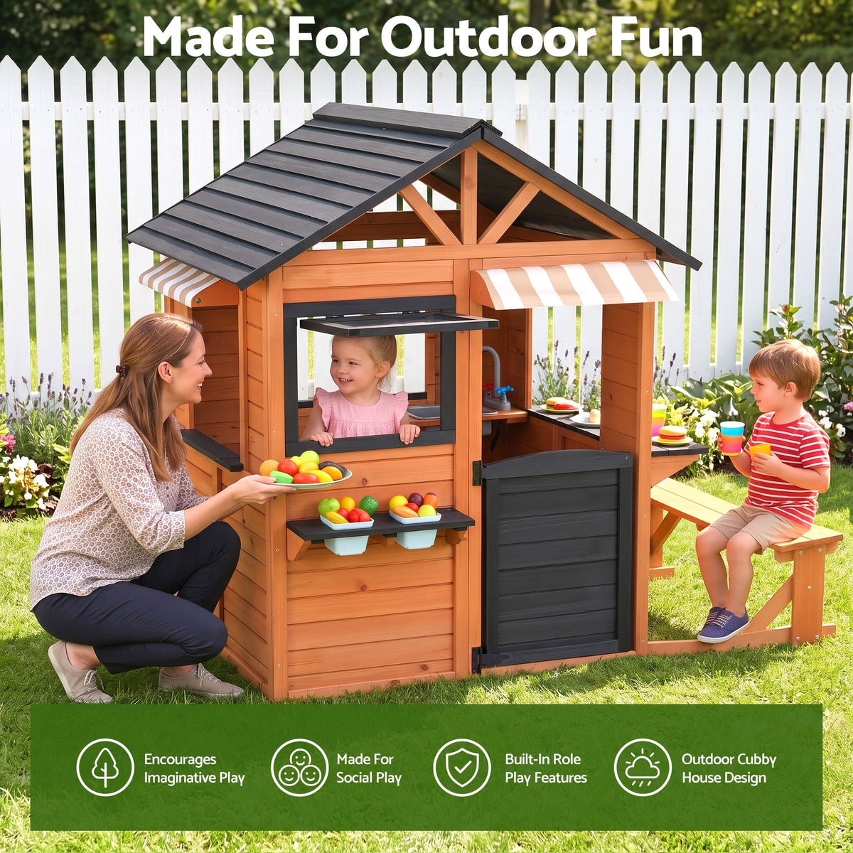 Wooden pretend play kitchen and cubby house for kids, featuring outdoor playhouse with side bench, from Everything Baby.