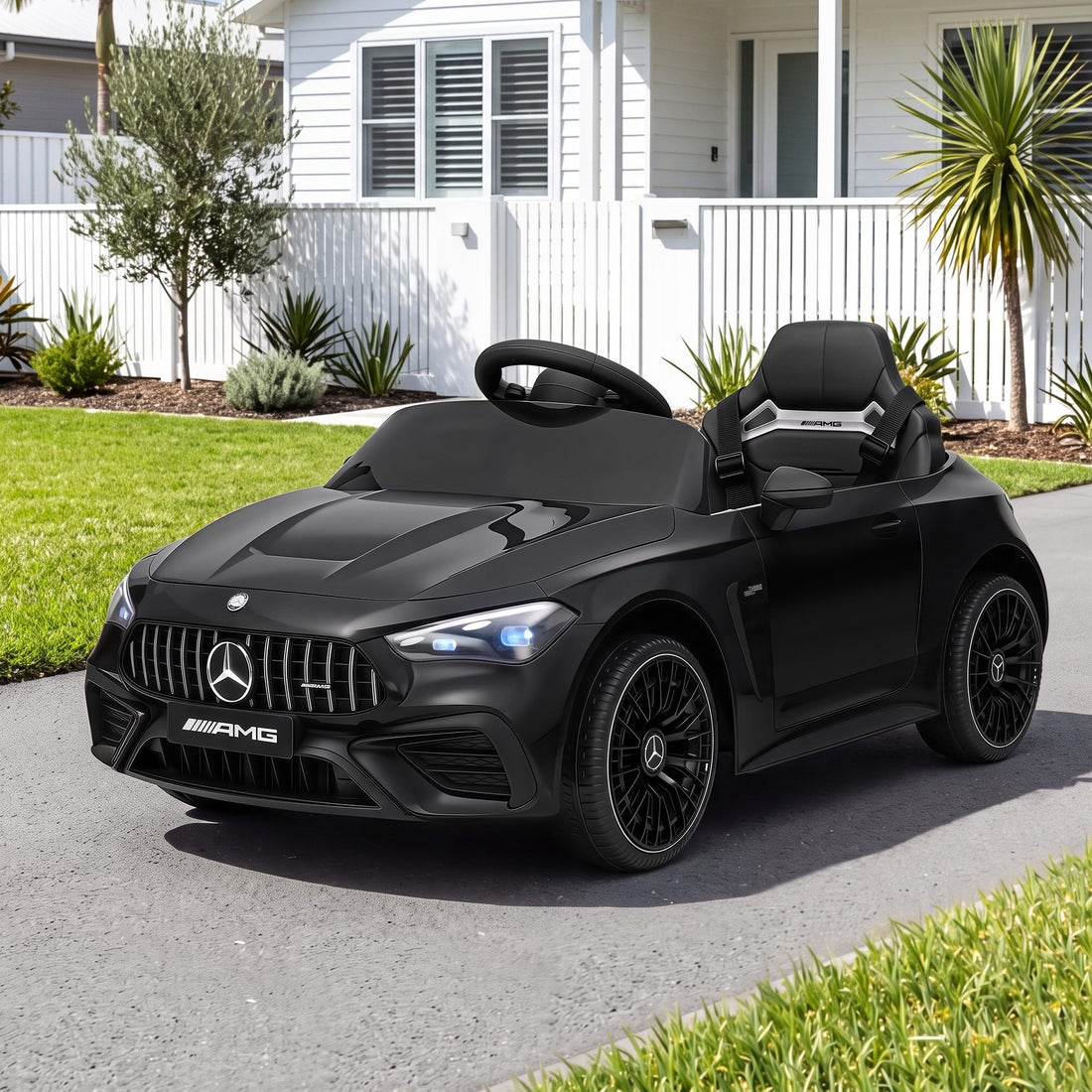 Black licensed Mercedes Benz AMG C63 kids ride-on car with 12V battery, featuring music and realistic design by Everything Baby.