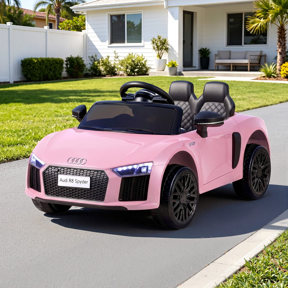 Pink licensed Audi R8 12V electric ride-on car for kids, featuring realistic design and sturdy build, by Everything Baby.
