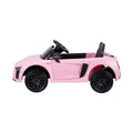 Pink licensed Audi R8 12V electric ride-on car for kids, featuring realistic design and battery-powered fun for children.