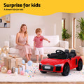 Red licensed Audi R8 12V electric ride-on car for kids with realistic design and branding, suitable for young children to drive.