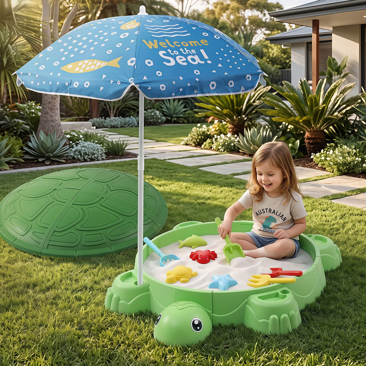 Green Keezi turtle sandbox toy with umbrella lid, includes 8 accessories for kids aged 3+ in a colorful activity toy setting.