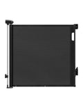 Keezi black retractable baby gate extending up to 140cm, safety fence for pets and children, with mesh design and secure locking mechanism.
