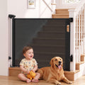 Black Keezi retractable baby and pet safety gate extending up to 140cm, shown in a home with the gate installed.