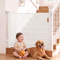 Keezi white retractable baby and pet safety gate extended to 140cm, featuring mesh design and secure locking mechanism.