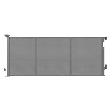 Grey Keezi retractable baby and pet safety gate extending up to 400cm, shown in a secure doorway setting.