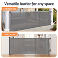 Grey Keezi retractable baby and pet safety gate extending up to 400cm, shown in a home setting with secure safety features