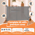 Grey Keezi retractable baby and pet safety gate extended to 400cm, showing the mesh fabric and secure side mounts.