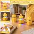 Four duck-themed button keychains with LED lights, fidget toys for stress relief and sensory fun, ideal for kids and office pranks.