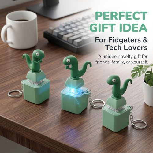Four lizard button keychains with sound and light, keyboard fidget toys for stress relief, colorful sensory activity toys for kids.