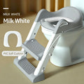 White potty training toilet with step stool and soft seat for toddlers, designed for kids' bathroom use.