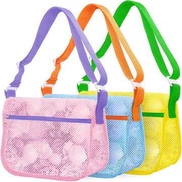 Three colorful mesh seashell collecting bags with adjustable straps, lightweight beach storage for kids to carry sand toys and shells.
