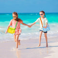 Three colorful mesh seashell collecting bags with adjustable straps, lightweight beach storage for kids' sand toys and shell hunting.