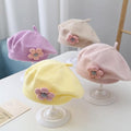 Cute purple girls' winter beret hat for toddlers, knitted floral design, warm and stylish for cold weather and daily wear.