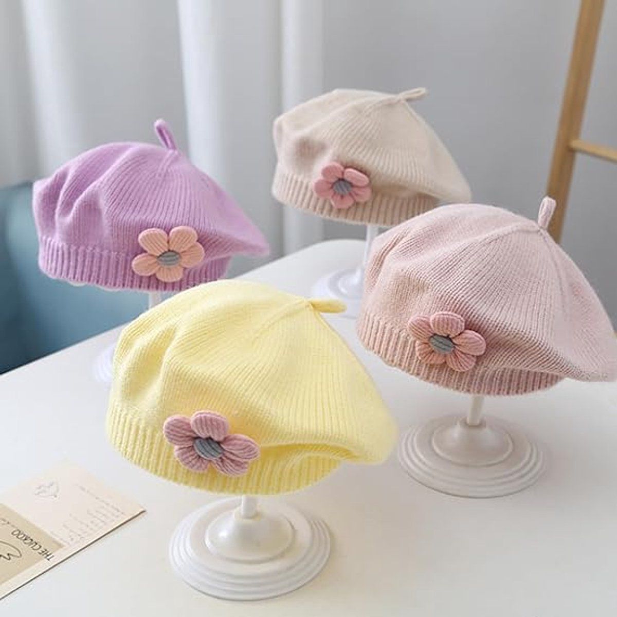 Cute beige girls' winter beret hat for toddlers, French knitted style with floral design, ideal for cold weather and daily winter wear.