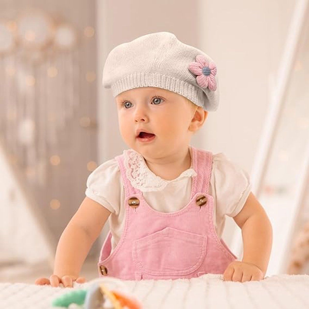 Girls' beige knitted winter beret hat for toddlers, adorable floral design, warm baby and kids winter hat for cold weather and travel.