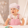 Pink girls' winter knitted beret hat for toddlers, cute floral design, warm and cozy for cold weather, perfect for daily wear and travel.