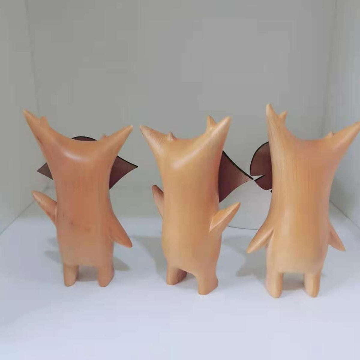 Three anime-style resin wood statues of cute characters for kids' or gaming room decor, perfect for pretend play and family fun.