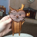 Three cute anime-style wood and resin family game lovers statues for kids' room or gaming room decor.
