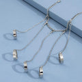 Silver punk chain tassel bracelet with slave finger rings, gothic hand chain and hip hop style for women and girls.
