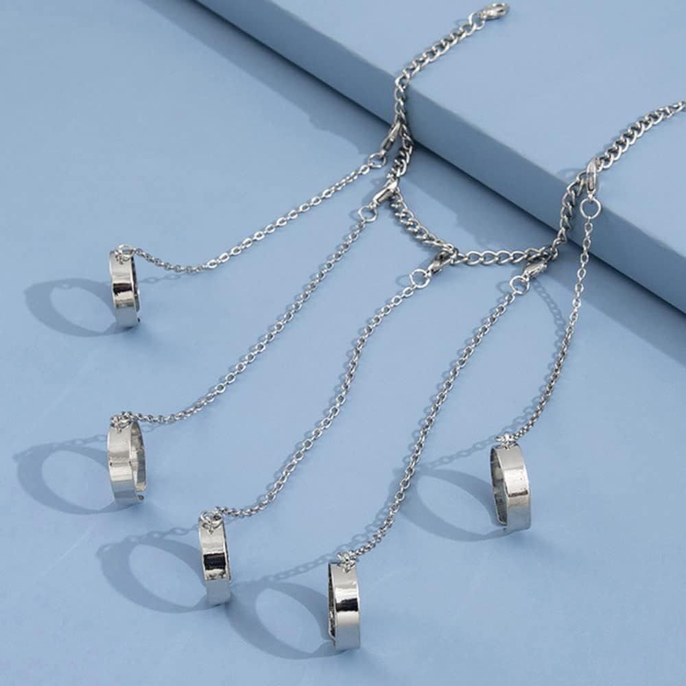 Silver punk chain tassel bracelet with slave finger rings, gothic hand chain and hip hop style for women and girls.