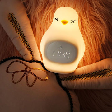 Cute kids alarm clock with soft BPA-free silicone nursery lamp, toddler nightlight ideal for girls and boys, portable and child-friendly.