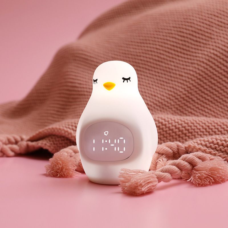 Cute kids alarm clock with soft BPA-free silicone nursery lamp, portable nightlight for children, ideal for toddlers and preschoolers.