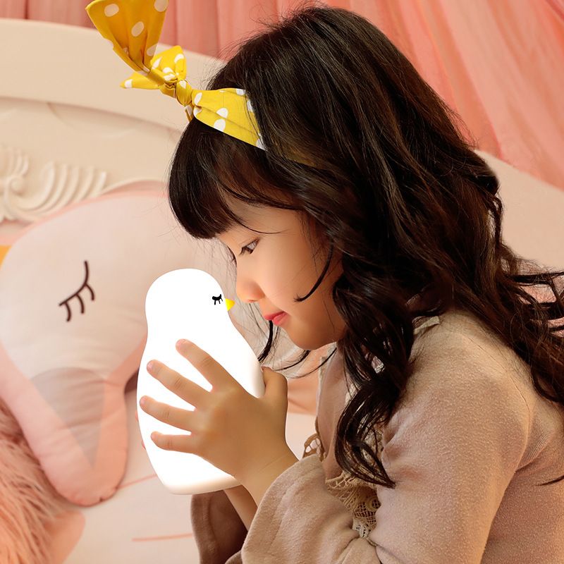 Cute kids alarm clock with soft BPA-free silicone nursery lamp, portable nightlight for children, girls, and boys in pretend play setting