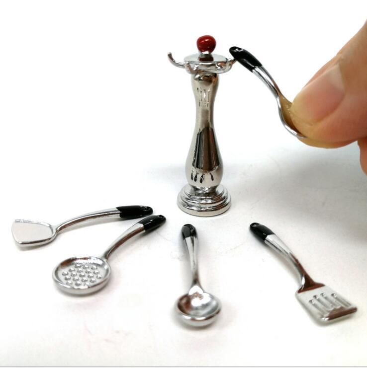 Miniature toddler kitchen utensils set with spoon, shovel, and cookware for dollhouse pretend play by Everything Baby.