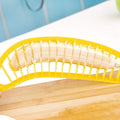 Banana slicer made of ABS plastic and stainless steel, designed for quick, safe banana slicing in kitchen and baby feeding.