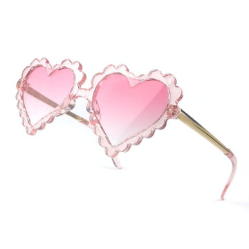 Cute girl heart-shaped sunglasses for toddlers, UV protection, ideal for outdoor parties and beach days, by Everything Baby.