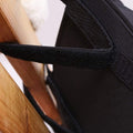 Black bedside hanging storage bag with 8 pockets, designed for bunk beds and hospital bed rails, from Everything Baby.