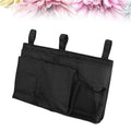 Black bedside hanging storage bag with 8 pockets, ideal for bunk beds and hospital bed rails, by Everything Baby.