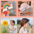 Set of 24 colorful baby girl hair clips featuring rainbow, flower, fruit, and dessert patterns, made by Everything Baby.