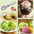 Heavy duty stainless steel ice cream scoop with trigger for easy serving, ideal for fruit or ice cream, by Everything Baby.