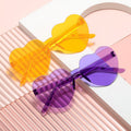 Multicolor heart-shaped frameless sunglasses for girls, women, and men, stylish party favors by Everything Baby.