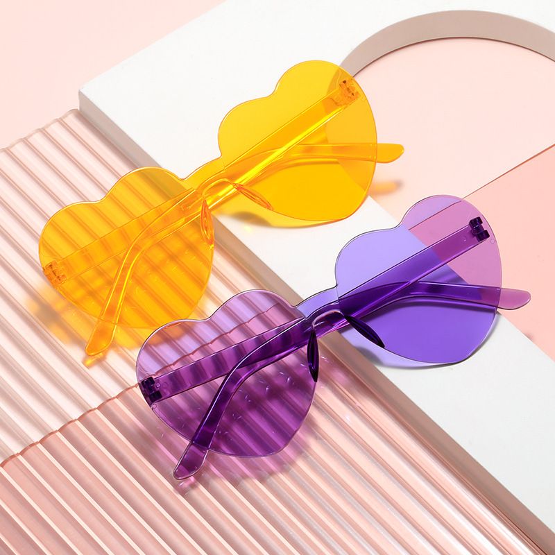 Multicolor heart-shaped frameless sunglasses for girls, women, and men, stylish party favors by Everything Baby.