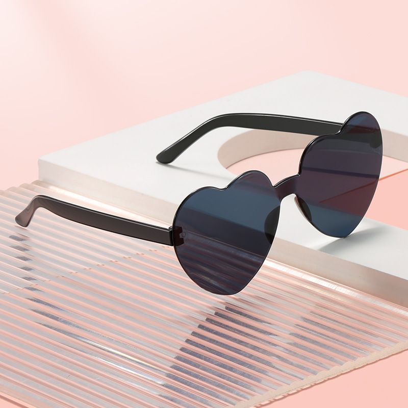 Set of three multicolor heart-shaped frameless sunglasses for girls and women, perfect for parties and fun fashion accessories.