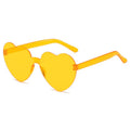 Multicolor heart-shaped sunglasses for girls and women, frameless transparent glasses with playful heart designs, perfect for parties.