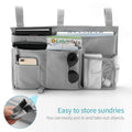 Grey hanging bedside caddy with 8 pockets for bunk beds and hospital rails, ideal for organizing baby and kid essentials.