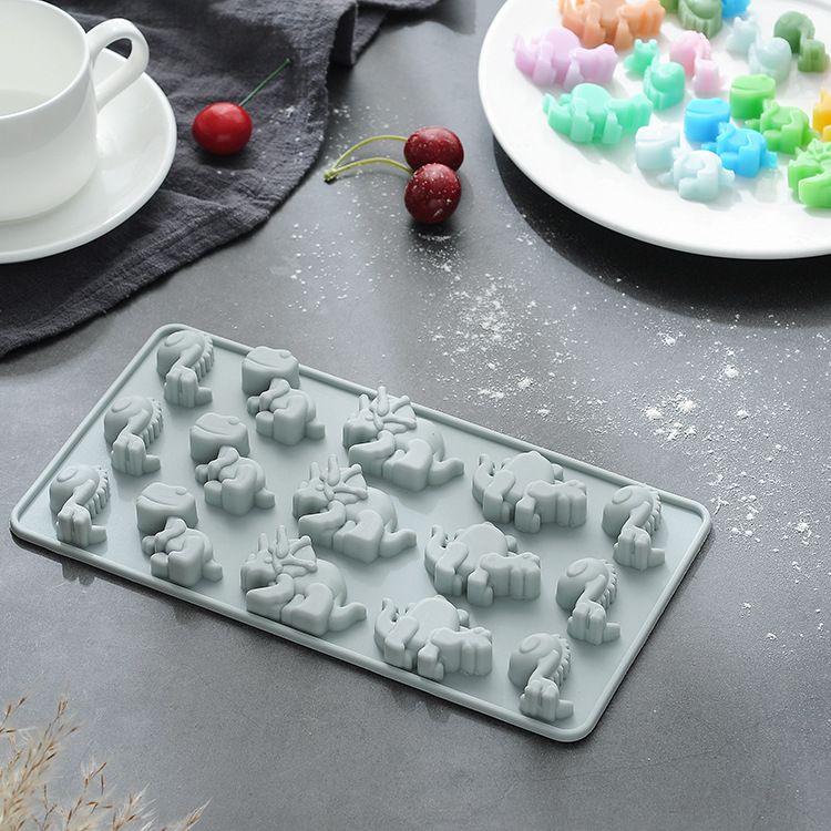 Dinosaur-shaped chocolate silicone mold by Everything Baby, non-stick food-grade baking tray for homemade kids' treats and pretend play.