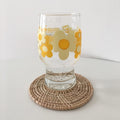 Handmade natural rattan coaster set with woven design, ideal for drinks, featuring rustic farmhouse boho wicker style.