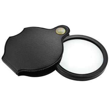 Black folding pocket magnifier loupe with rotating leather holster, 70mm lens, ideal for reading, science, and hobbies.