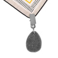 Six teardrop-shaped tablecloth weights with metal clips, designed for secure fabric coverage, in a neutral stone color by Everything Baby.
