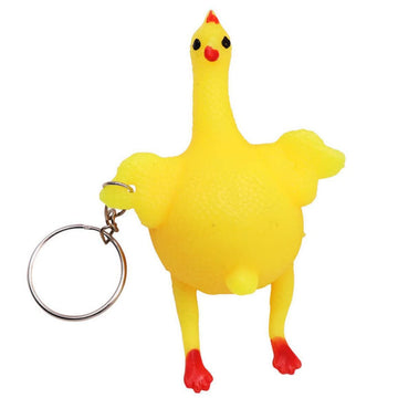 Squeeze chicken toy keychain featuring a laying hen egg design, fun stress relief gadget for kids, part of pretend play toys.