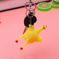 Squeeze chicken toy keychain featuring a laying hen egg design, fun and tricky stress relief gadget for kids, part of pretend play toys
