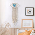 Beige large boho dream catcher with evil eye design, macrame wall hanging for bedroom or home decor, woven ornament.