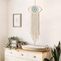Beige large boho dream catcher with evil eye design and macrame hanging, ideal as bedroom or dorm room wall decor