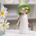 Cute resin kid statue blowing bubbles, small figurine for shelf decor, adorable pretend play toy for boys and girls.