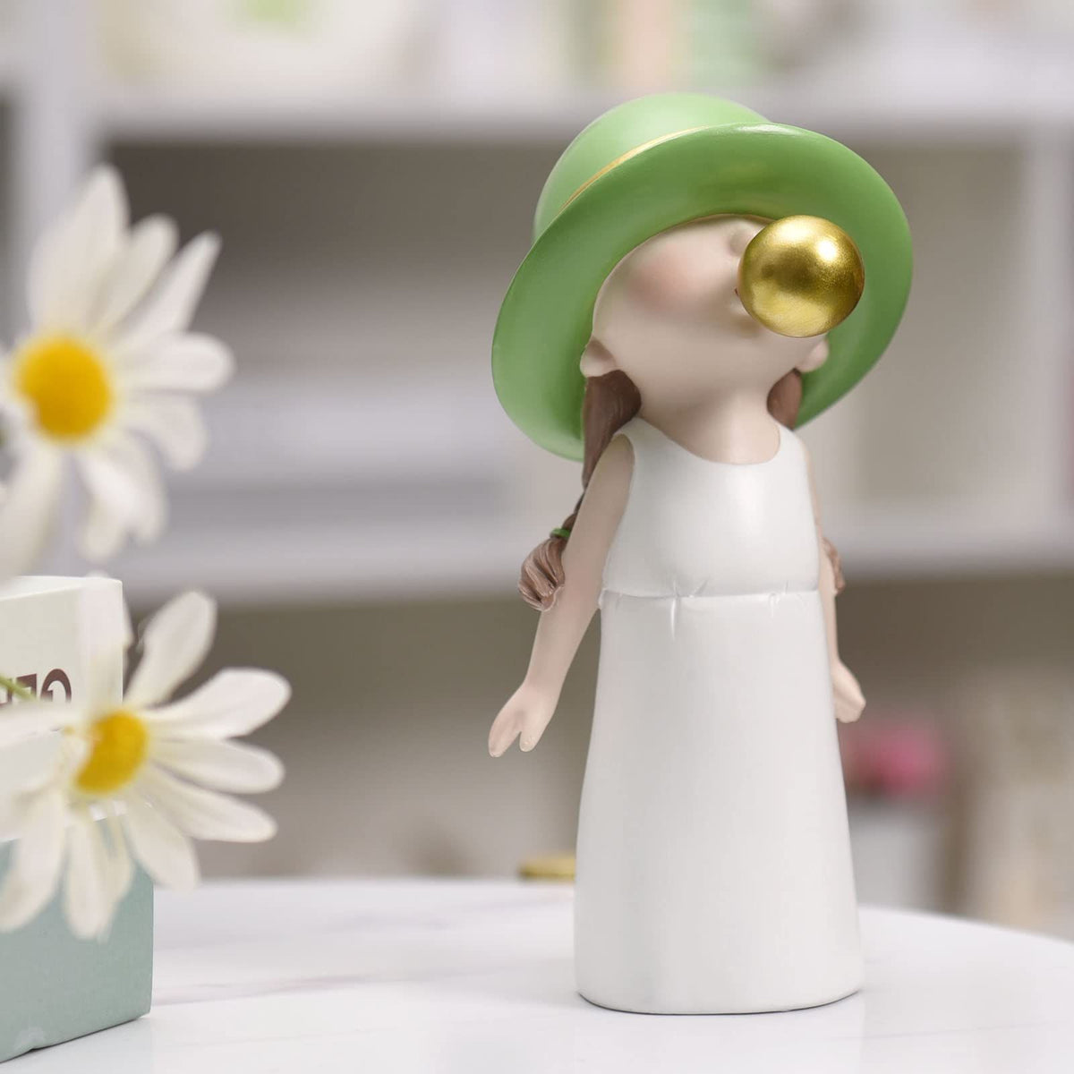 Cute resin kid statue blowing bubbles, small figurine for shelf decor, adorable pretend play toy for boys and girls.